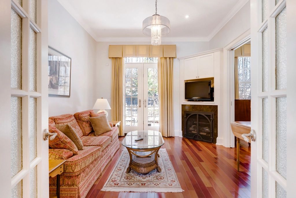 A suite sitting room with a sofa and armchairs
